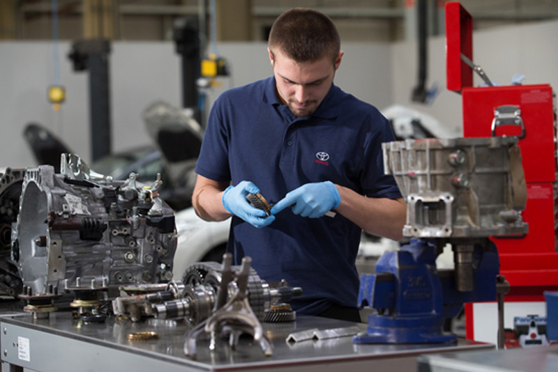 A photograph of a Toyota apprentice working